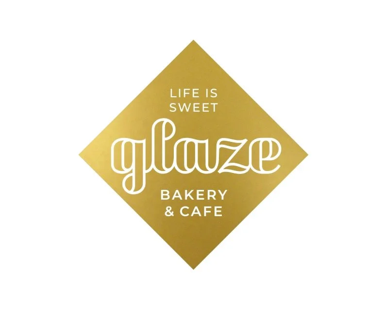 Logo for Glaze Bakery & Cafe with the slogan 'Life is Sweet' on a gold diamond background.