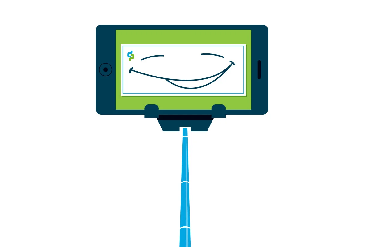 Smartphone with a drawing of a smiling face on its screen, attached to a selfie stick.