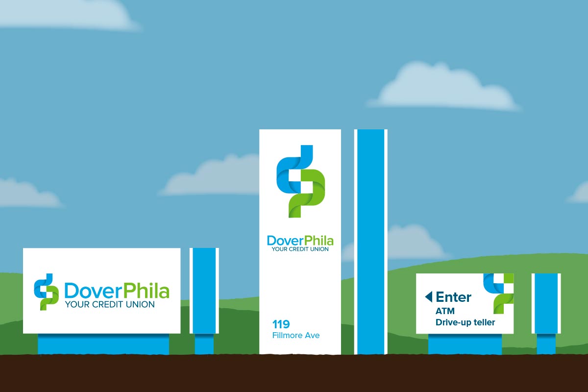 Illustration of a financial institution called DoverPhila Your Credit Union with signage including the logo, address '119 Fillmore Ave,' a drive-up ATM and teller, and a background of a sunny sky with clouds and a grassy green landscape.