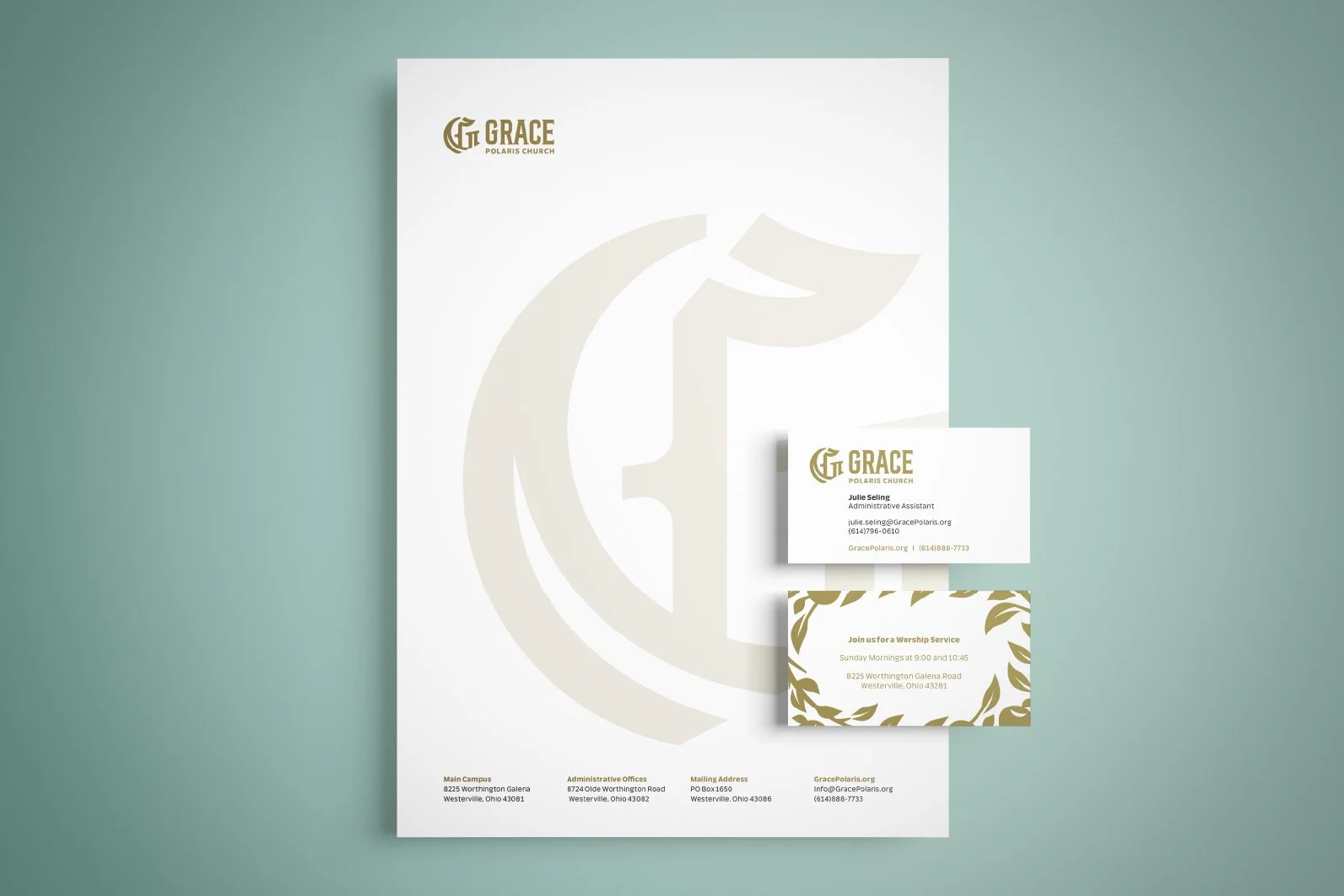 Church branding materials including a large poster and two business cards for Grace Polaris Church, with a beige church logo and contact information on a mint green background.