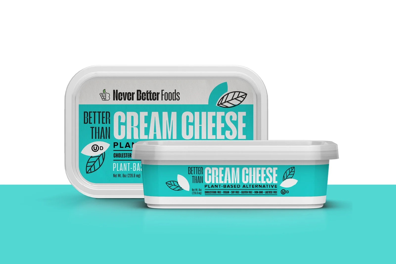 Containers of plant-based cream cheese from Never Better Foods, with a light gray and teal packaging design, featuring text highlighting its dairy-free and vegan qualities.