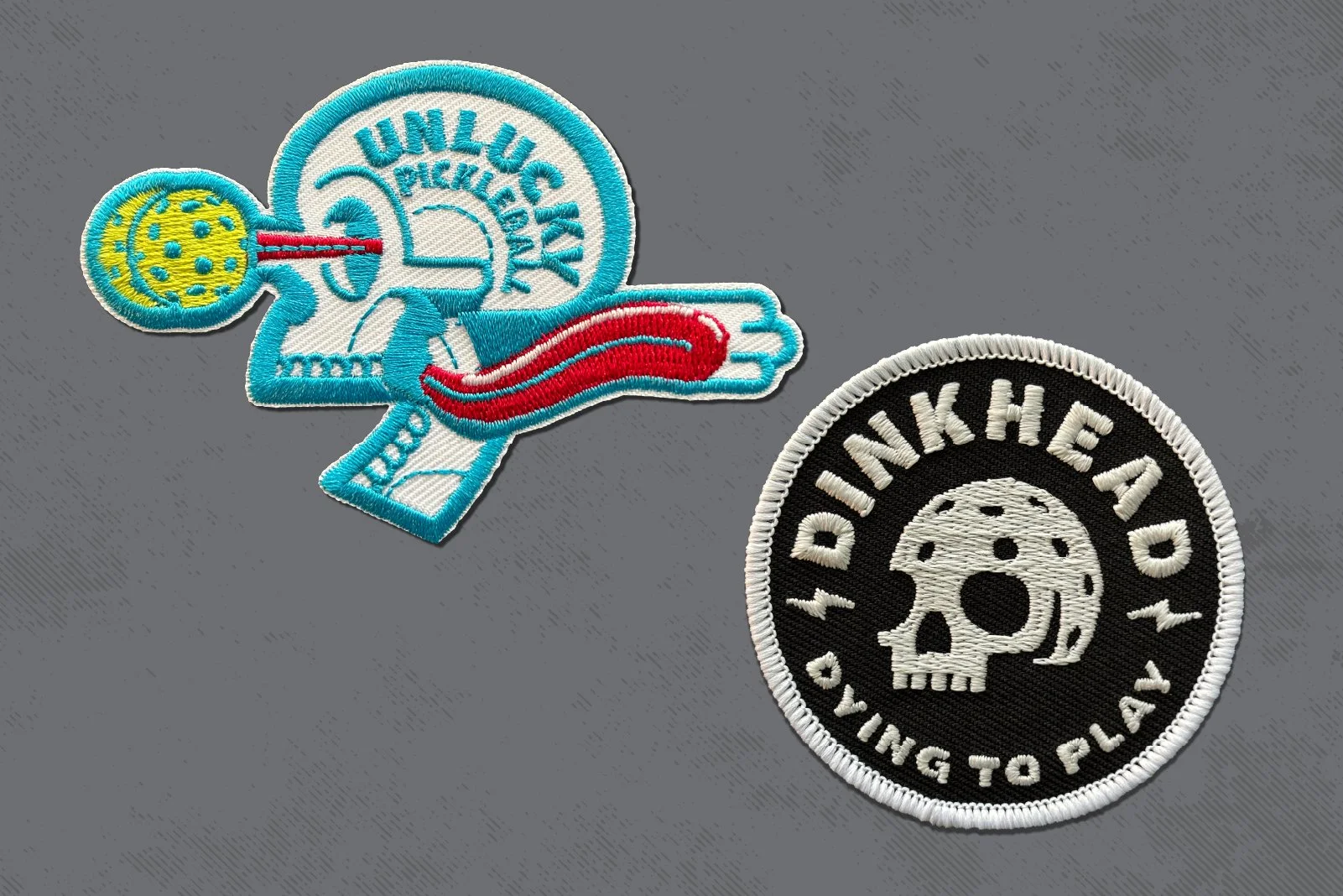 Two embroidered patches on a gray surface: one shows a skull with a mushroom cloud and the text "UNLUCKY PICKLE"; the other is black and white with a skull and the text "IDINK HEAD NOW, TALKING TO PLAY".