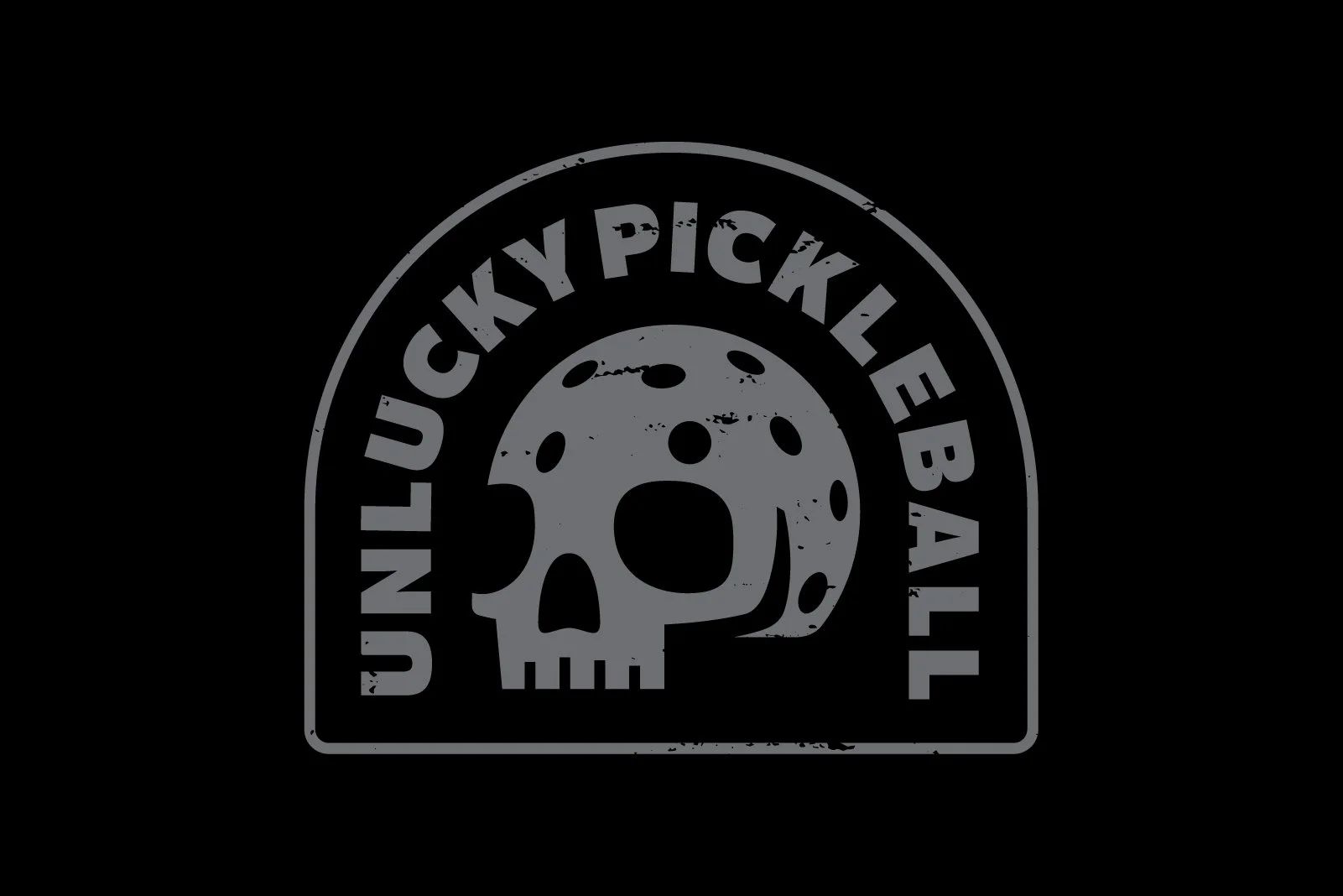 Logo with a skull illustration inside a circle, with the words "Lucky Pickleeball" curved around the top and bottom, on a black background.