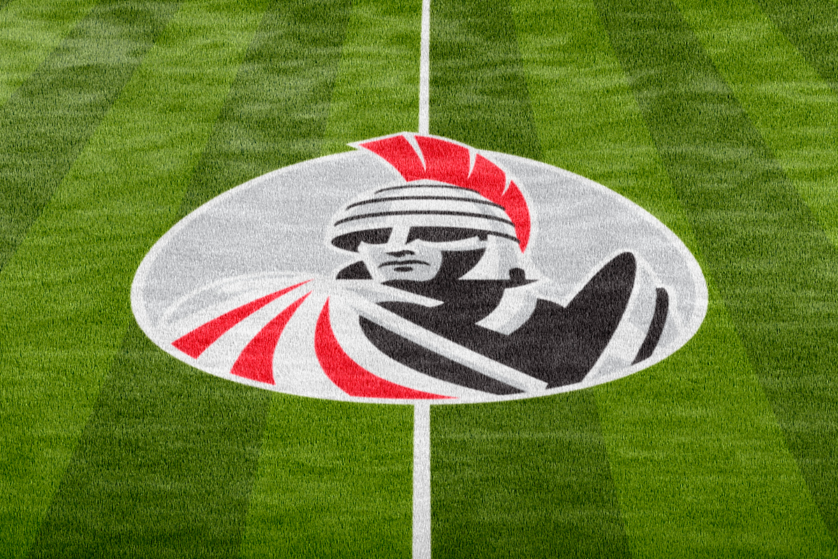A football field with the logo of the Tampa Bay Buccaneers painted in the center.