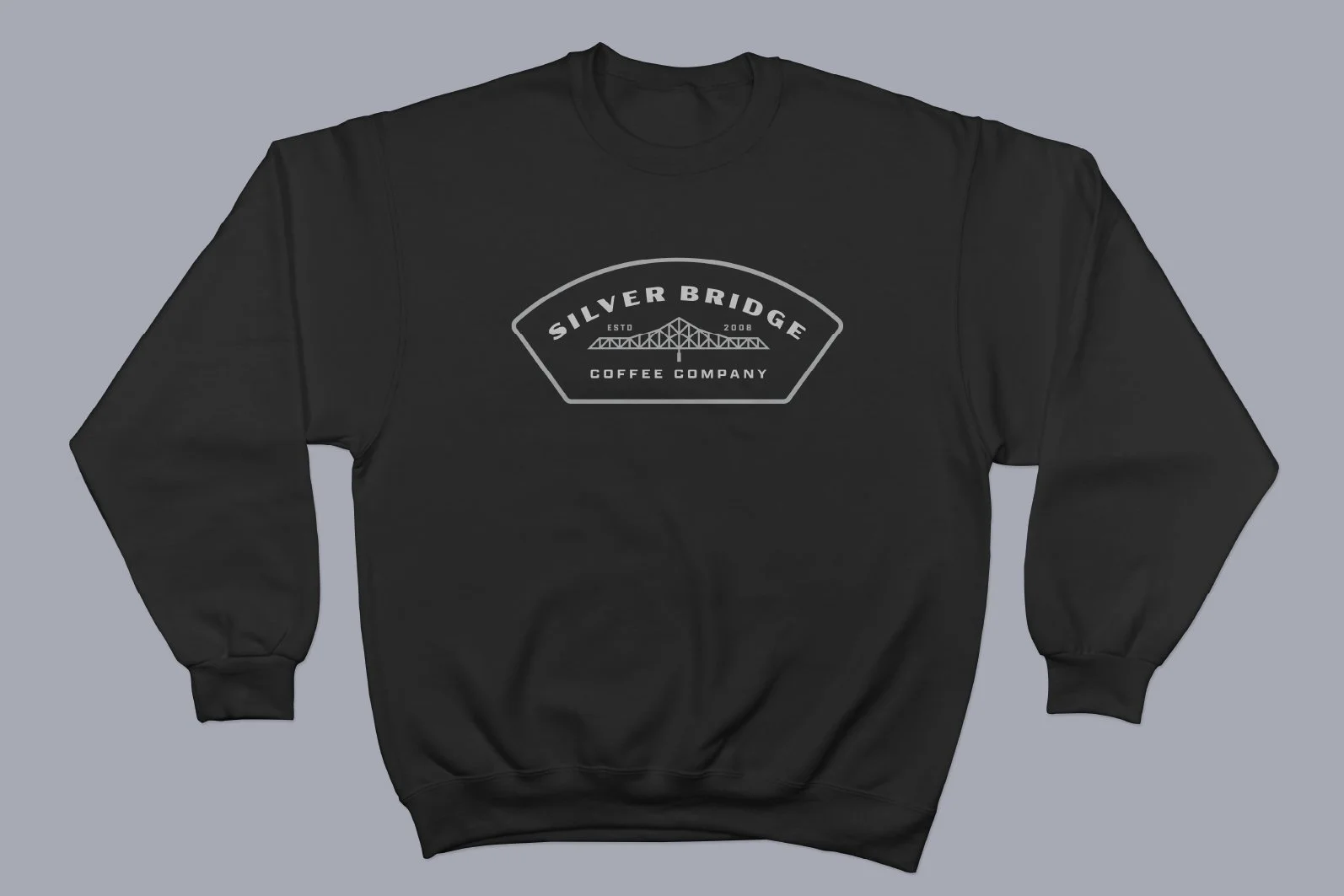 Black sweatshirt with a logo on the front that reads 'Silver Bridge Coffee Company' with an illustration of a bridge above the text.