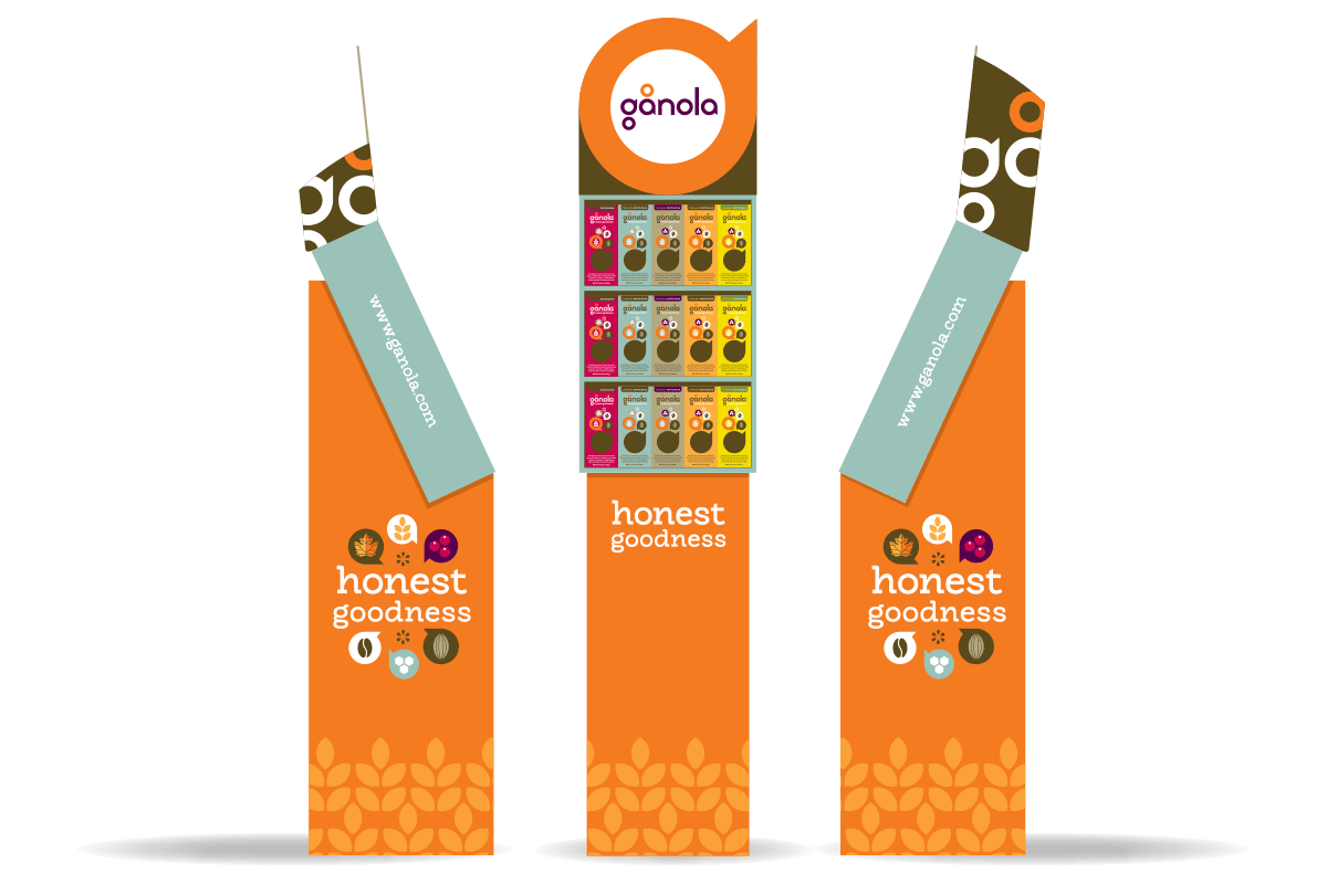 Display stand for Gânola, a brand of snack bars, featuring three orange bases with the brand name and logo, and product packages in the middle, each showing different flavors of snack bars.