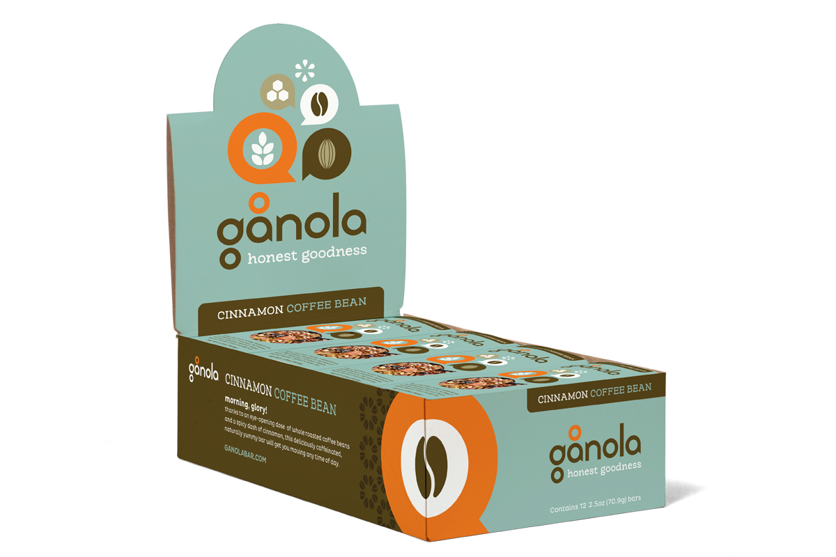 Box of Ganola cinnamon coffee bean snack bars, with a light teal and dark brown packaging featuring images of coffee beans and cinnamon sticks.