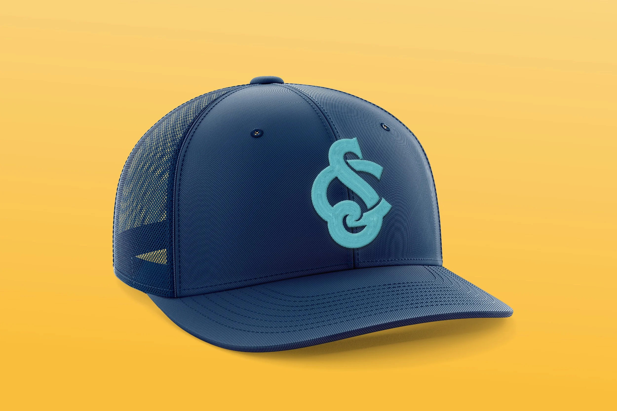 A blue trucker cap with a stylized logo on the front, set against a yellow background.