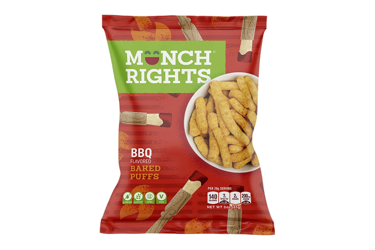 A bag of Monch Rights BBQ flavored baked puffs snack with an image of the puffed snack in a white bowl on the front of the package.