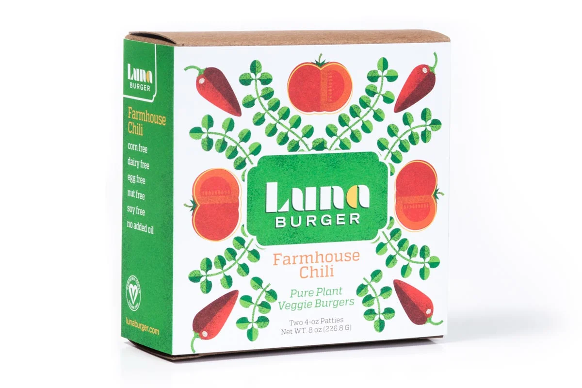 Package of Luna Burger Farmhouse Chili veggie burgers featuring tomato, chili pepper, and green plant illustrations.