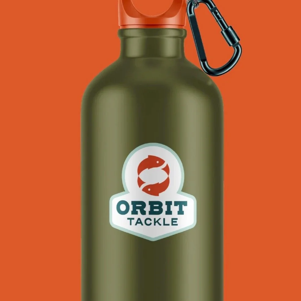 Green water bottle with orange cap, a black carabiner clip, and a logo featuring two fish and the words "Orbit Tackle" on orange background.