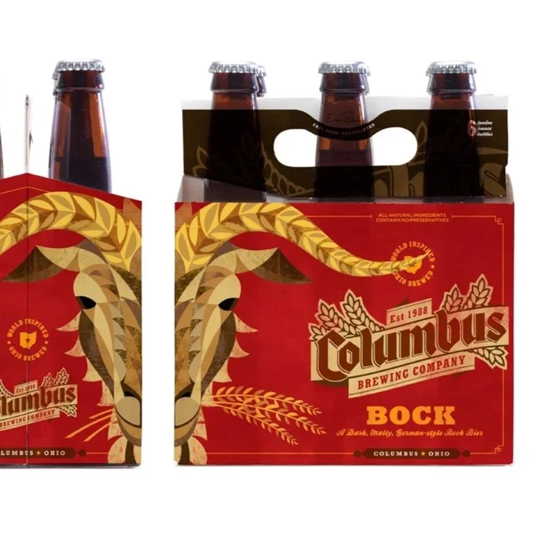 Six bottles of Columbus Brewing Company BOCK beer in a red and gold six-pack carrying case.