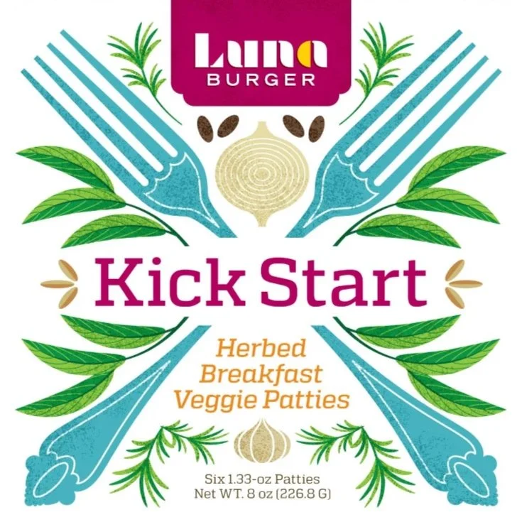 Packaging for Luna Burger Kick Start veggie patties, featuring a colorful design with forks, green leaves, garlic, and herbs, emphasizing herbed breakfast veggie patties.