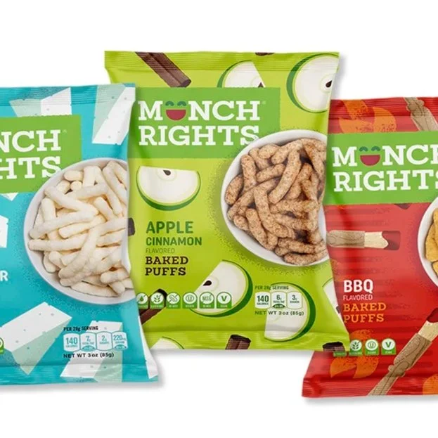 Three bags of Monoch Rights baked puffs snack chips in blue, green, and red packaging, each featuring different flavors: blue for sour cream, green for apple cinnamon, and red for BBQ.