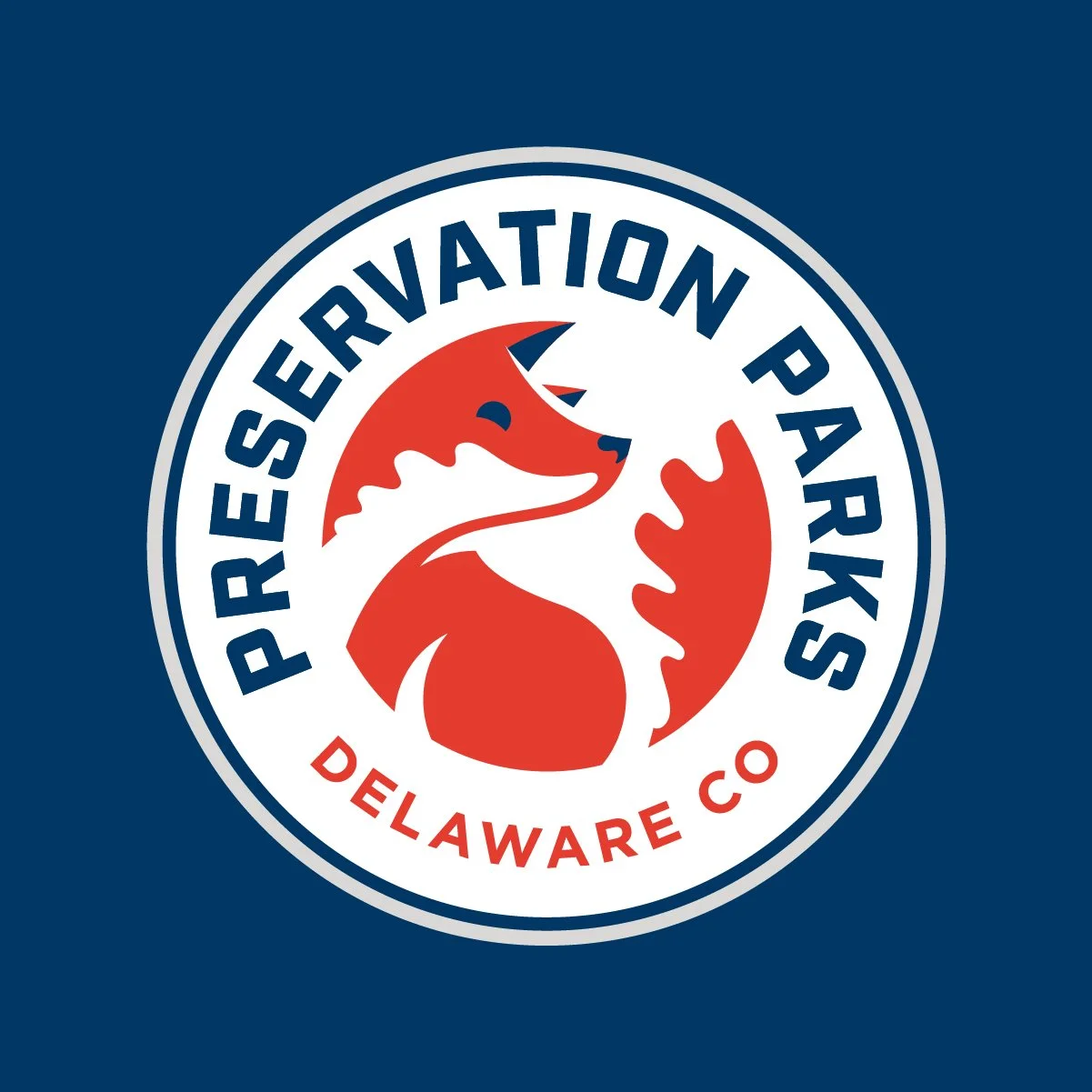 Preservation Parks of Delaware County logo featuring a stylized fox within a circular seal with the text 'Preservation Parks' and 'Delaware Co' on a dark blue background.