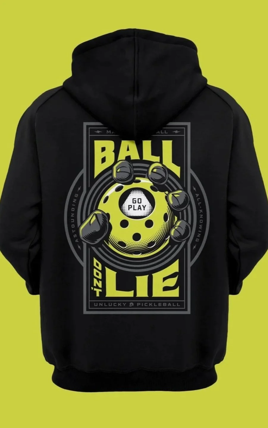 Black hoodie with yellow and white graphic of a pickleball, text saying "Ball Don’t Lie," "Go Play," and other phrases, on a green background.