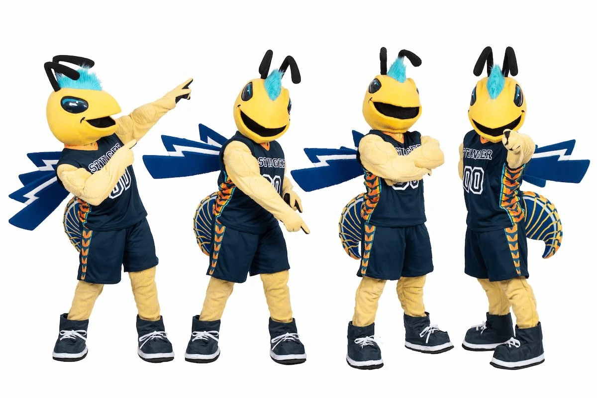 Four mascot characters dressed as yellow and blue bees in sports uniforms with wings, antennae, and striped tails, posing with different gestures.