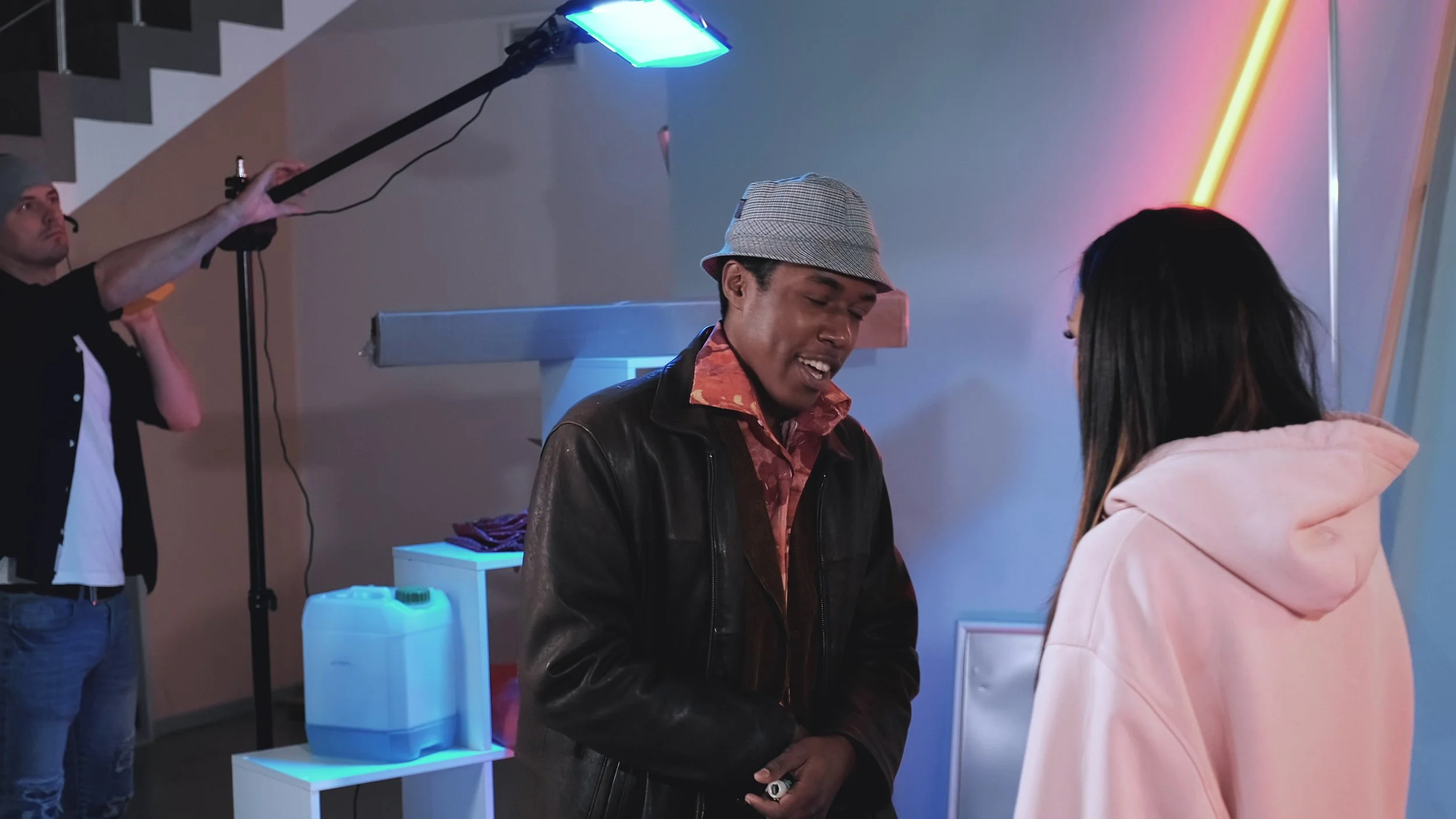 young-african-actor-and-actress-burst-in-the-laugh-during-the-movie-shooting-scene-in--SBI-350595806.jpg