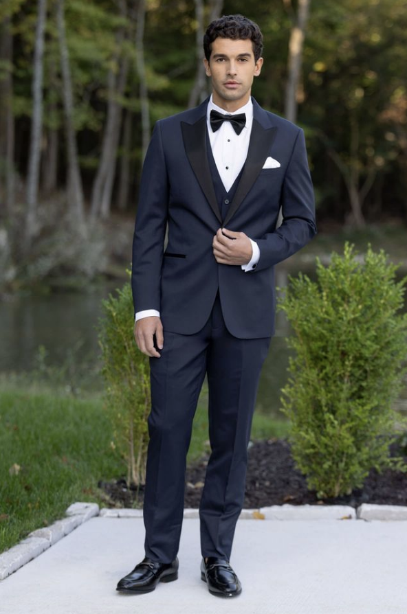 Man standing outside wearing a navy tux