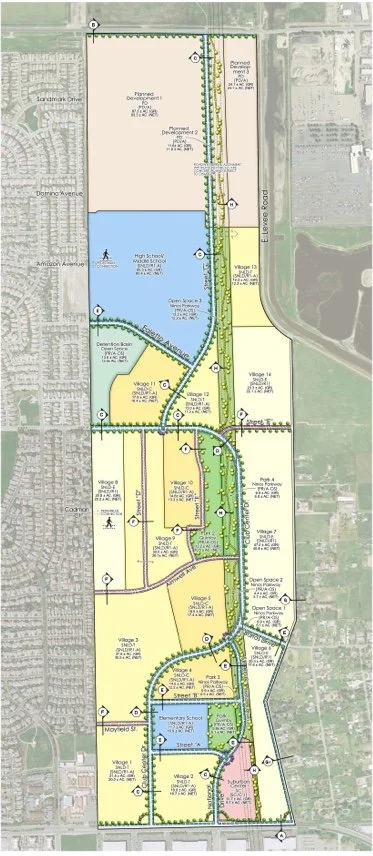 A detailed map showing a planned development area with zones labeled as residential villages, parks, schools, and other community facilities, along with roads and green spaces.