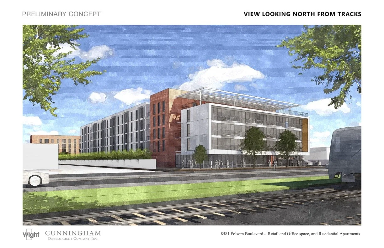 A conceptual rendering of a modern mixed-use building near train tracks, featuring retail, office space, and residential apartments with green trees and a partly cloudy sky.