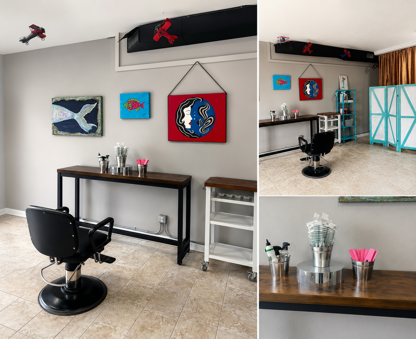 A salon or barber shop with a black styling chair, a wooden counter with hairdressing supplies, colorful aquatic-themed artwork on the wall, and a metal shelving unit. There are two small model airplanes attached to a black ceiling panel.
