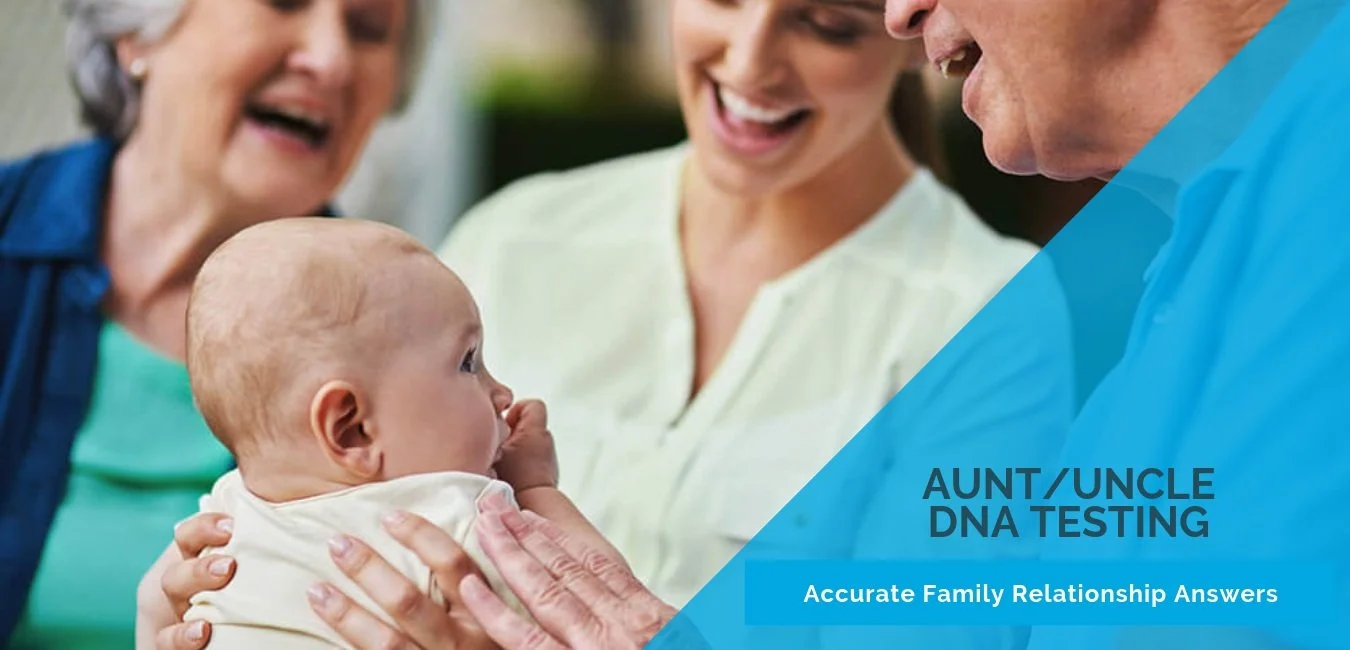 An elderly woman, a middle-aged woman, and a man are smiling and looking at a baby who is being held by the elderly woman. The baby has a thumb in their mouth and is looking at the elderly woman.