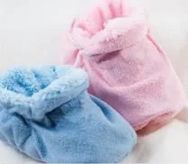 Two small plush bags, one pink and one blue, with soft, fluffy textures.
