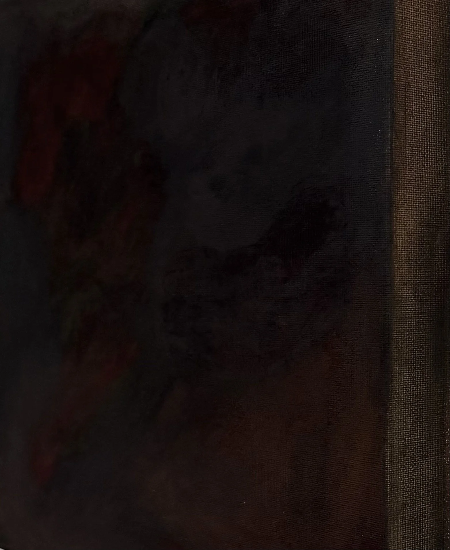 The image appears to be very dark with minimal visible details, making it difficult to identify what is in it.