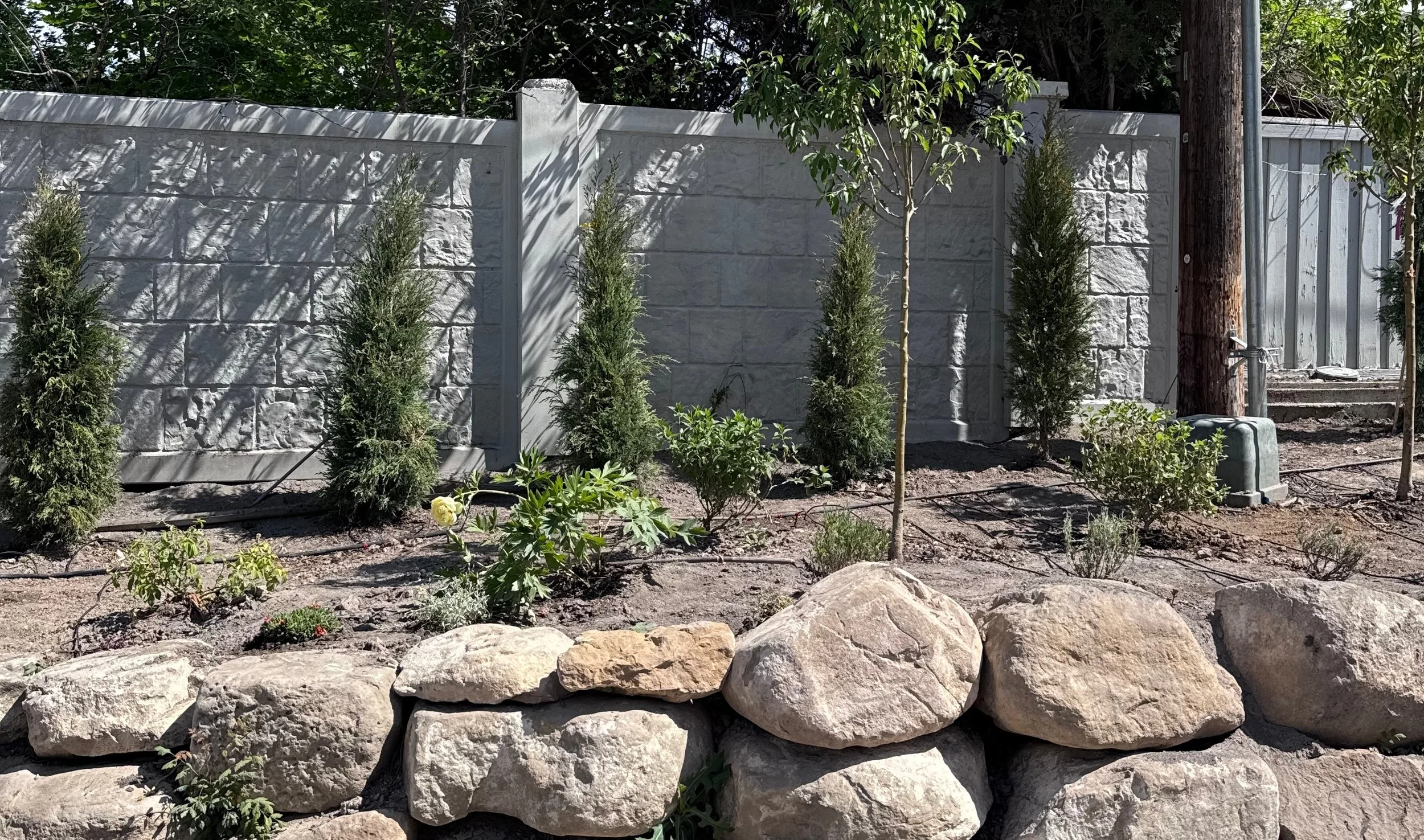rock wall with planter beds