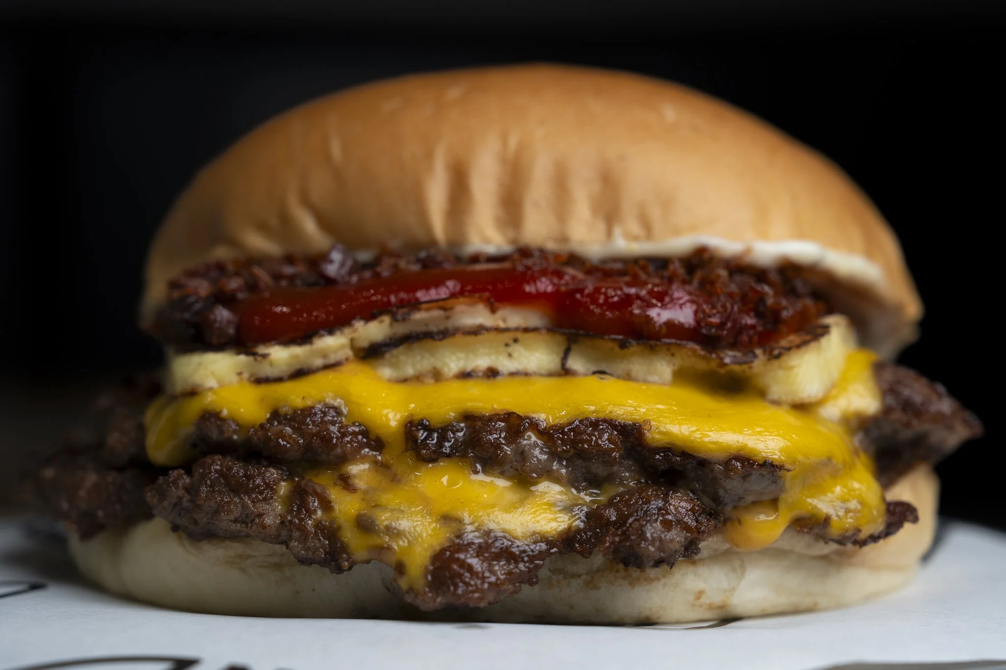 Romeo and Juliet burger from BrOz Burgers Sydney with grilled halloumi, guava ketchup and a smash beef patty on a toasted bun.