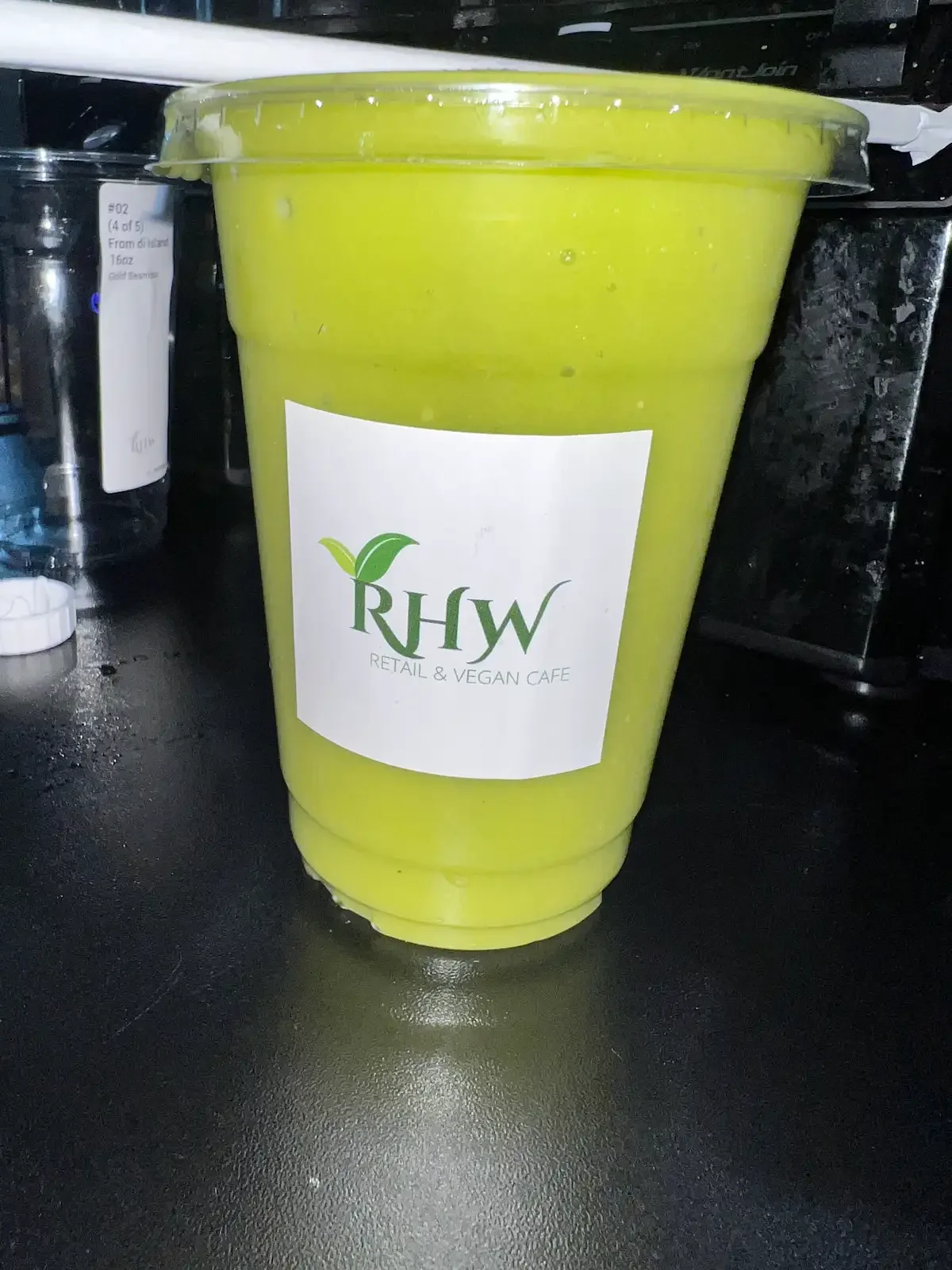 RHW Royal Sunrise sea moss smoothie in a branded cup