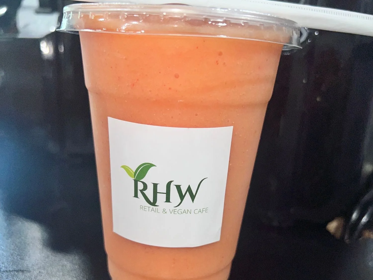 RHW’s From Di Island smoothie in a branded café cup.
