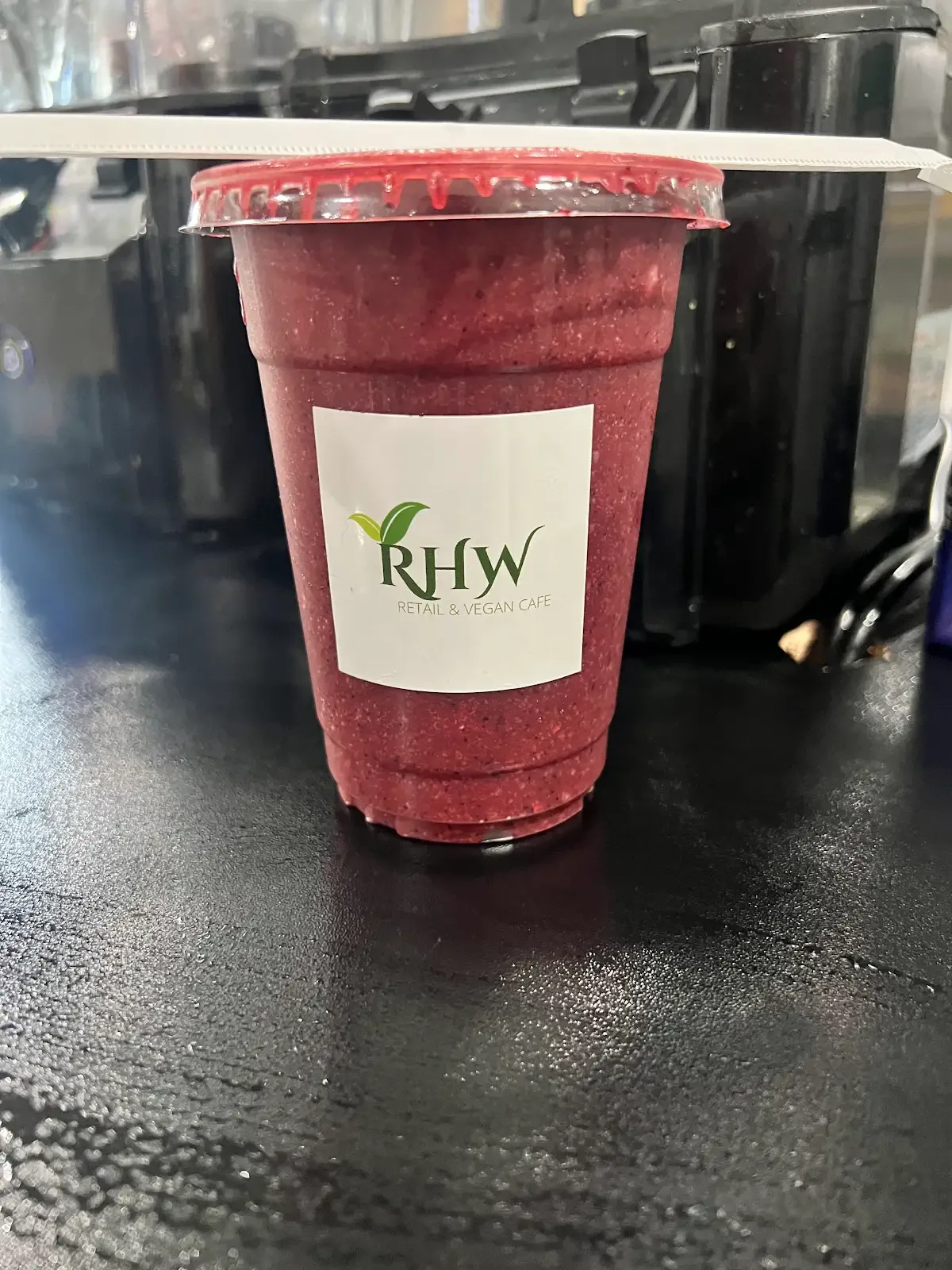 RHW Very Berry sea moss smoothie in a branded cup