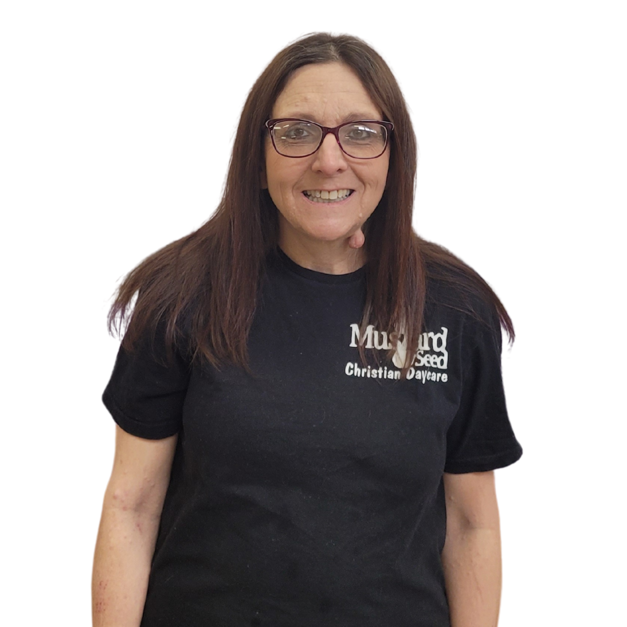 Woman with long brown hair and glasses smiling, wearing a black t-shirt with white text.