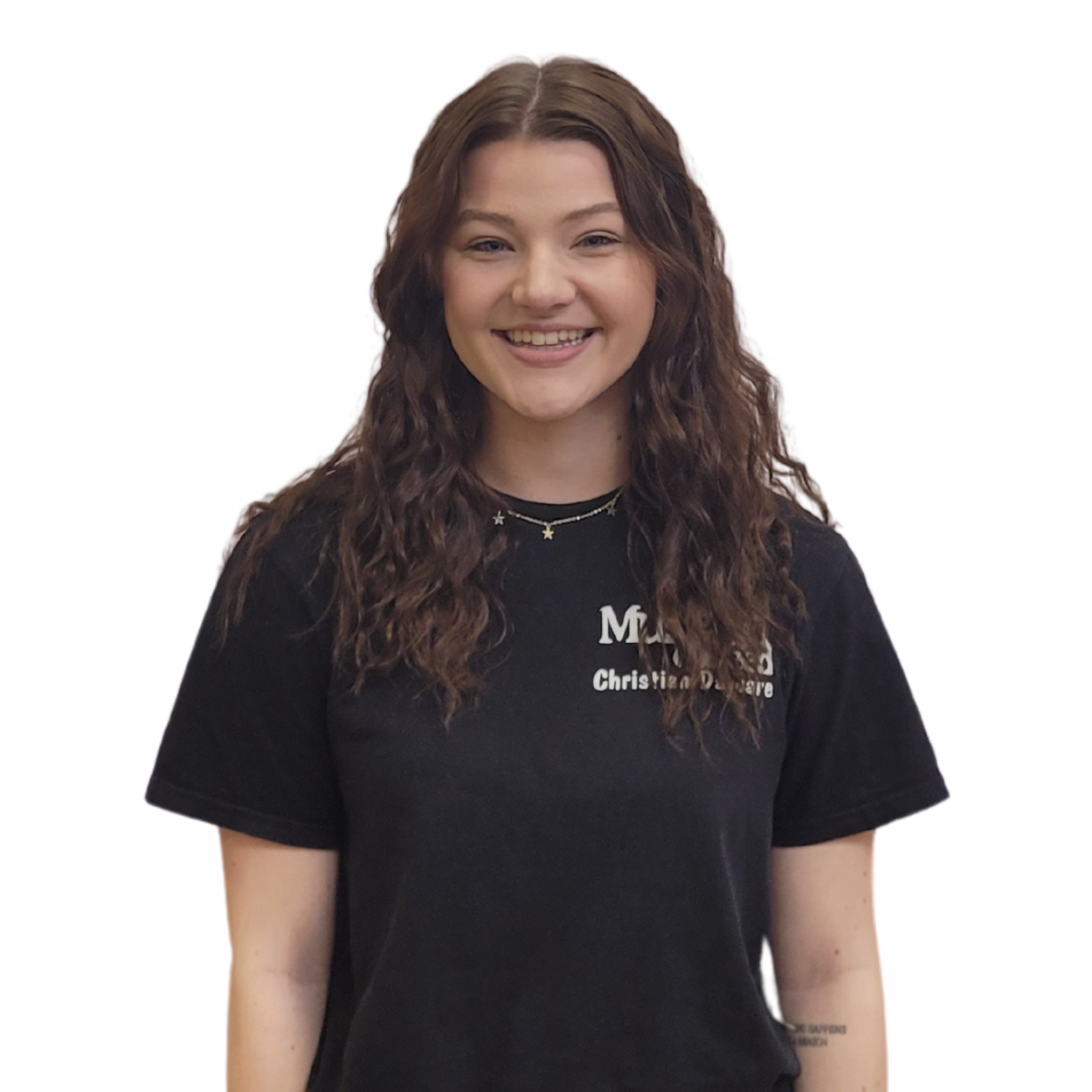 Smiling young woman with long, wavy brown hair wearing a black T-shirt and star-shaped necklaces.
