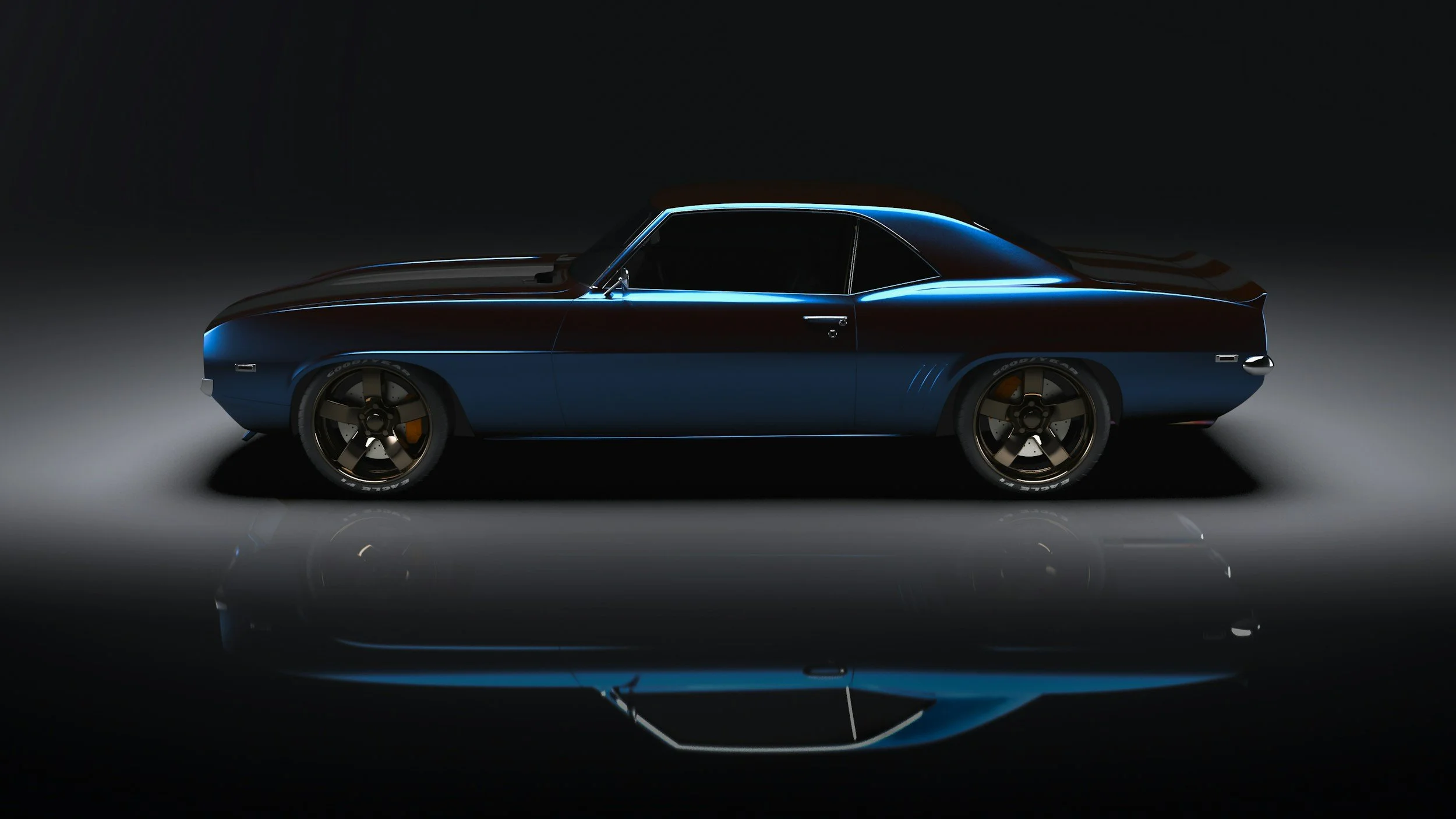 A sleek, dark blue vintage car with gold accents, low profile, and modern black wheels, photographed in a dark studio with reflection on the floor.