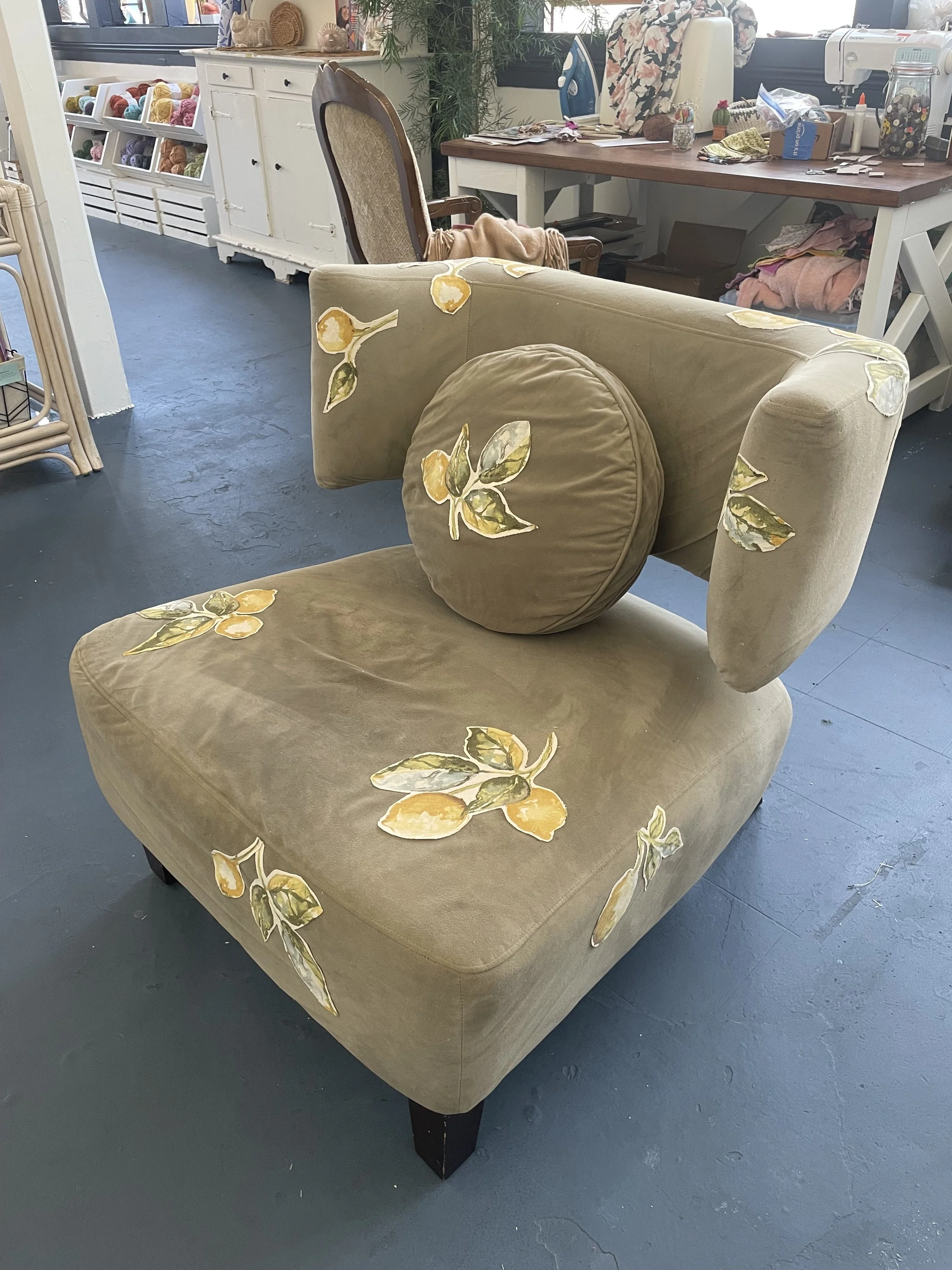 I got this chair for free, but it had some cat damage. I used fabric glue to attach some patches (the last of the beloved pillowcase) which were placed both strategically and aesthetically. 