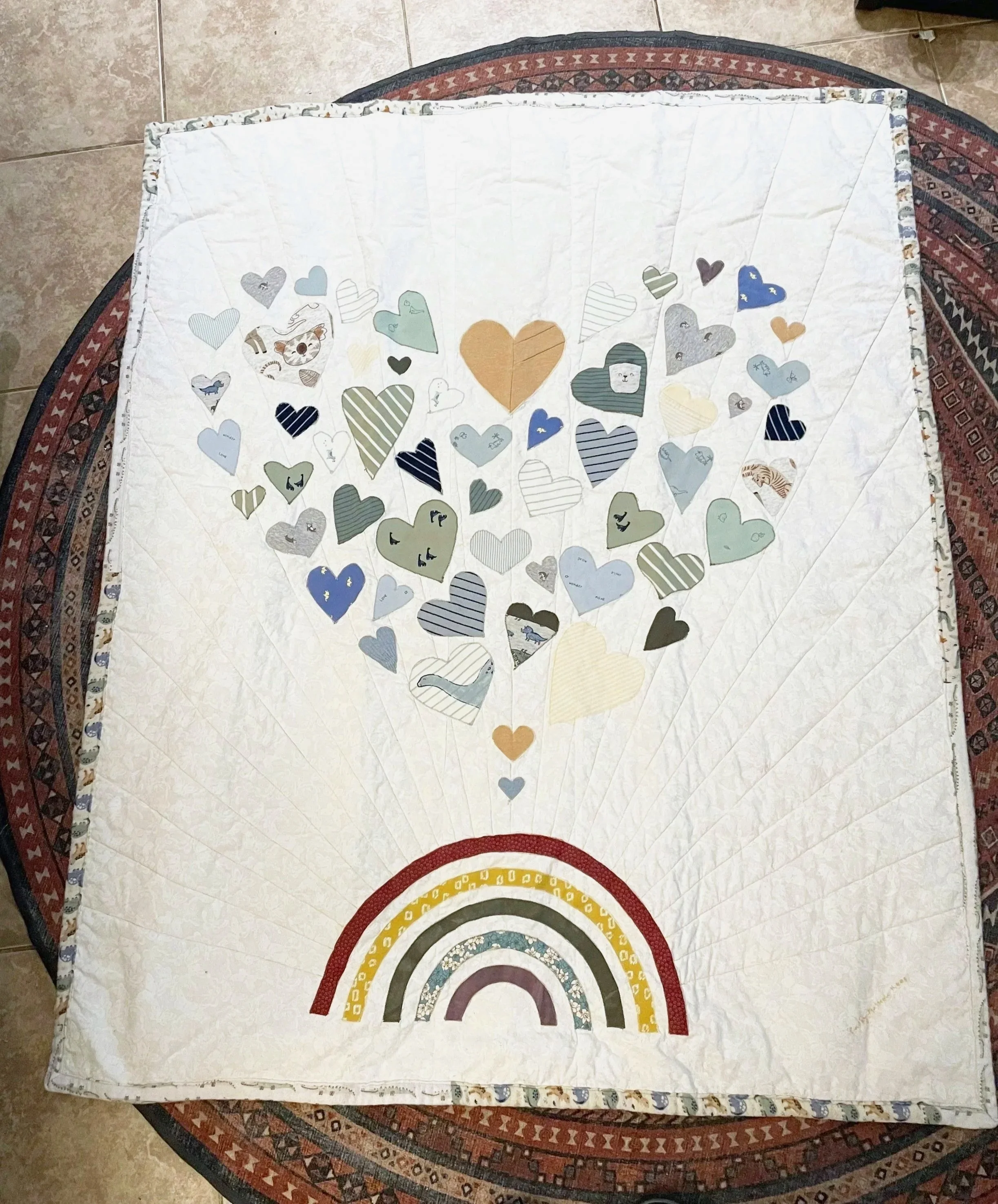I made this memorial quilt for a baby - the hearts were cut from his clothing. 