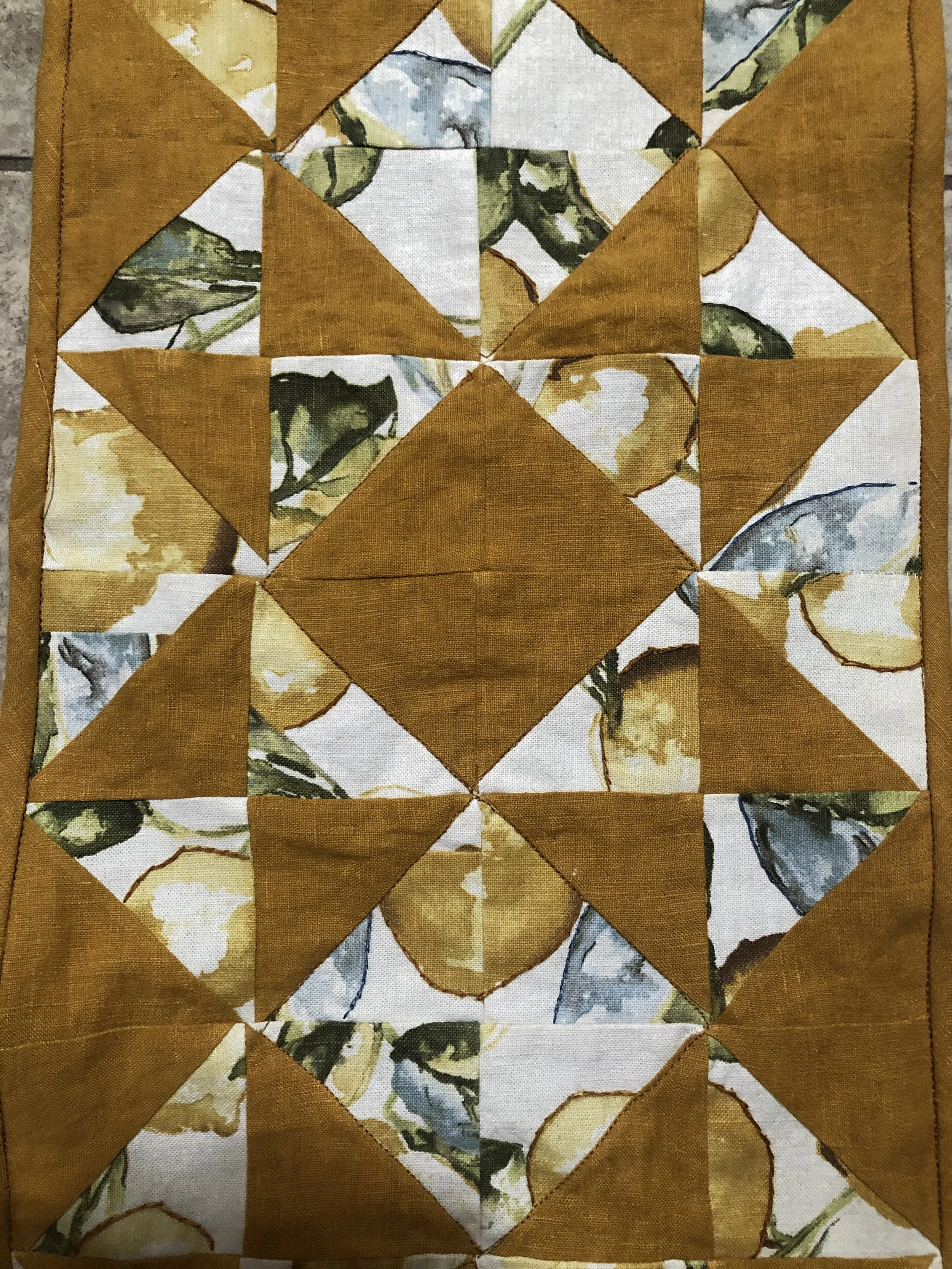 A simple table runner I made from a beloved pillowcase