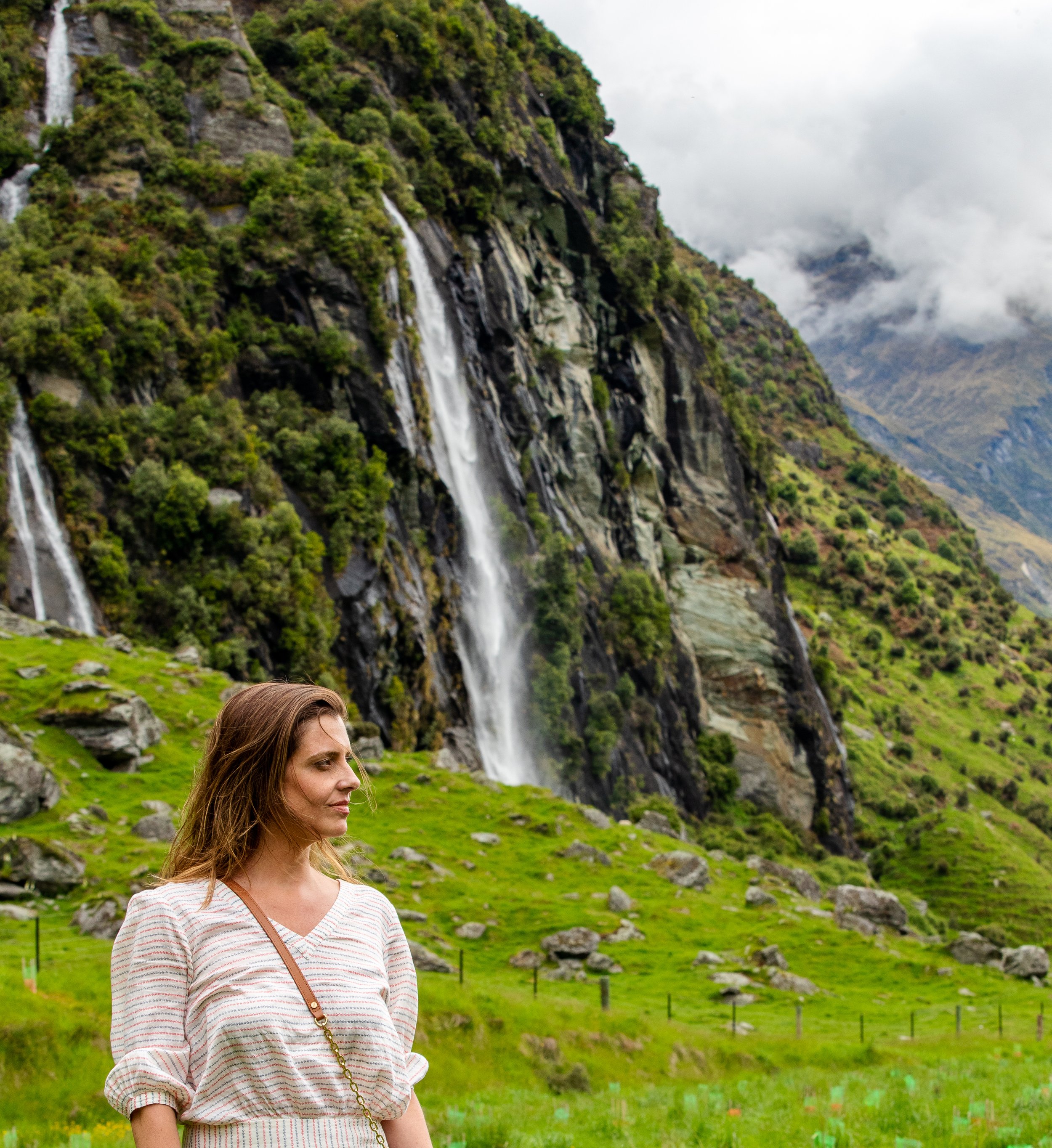 Karina Da Paixao Teixeira, counsellor and founder of Reframe Within, standing in a mountain landscape