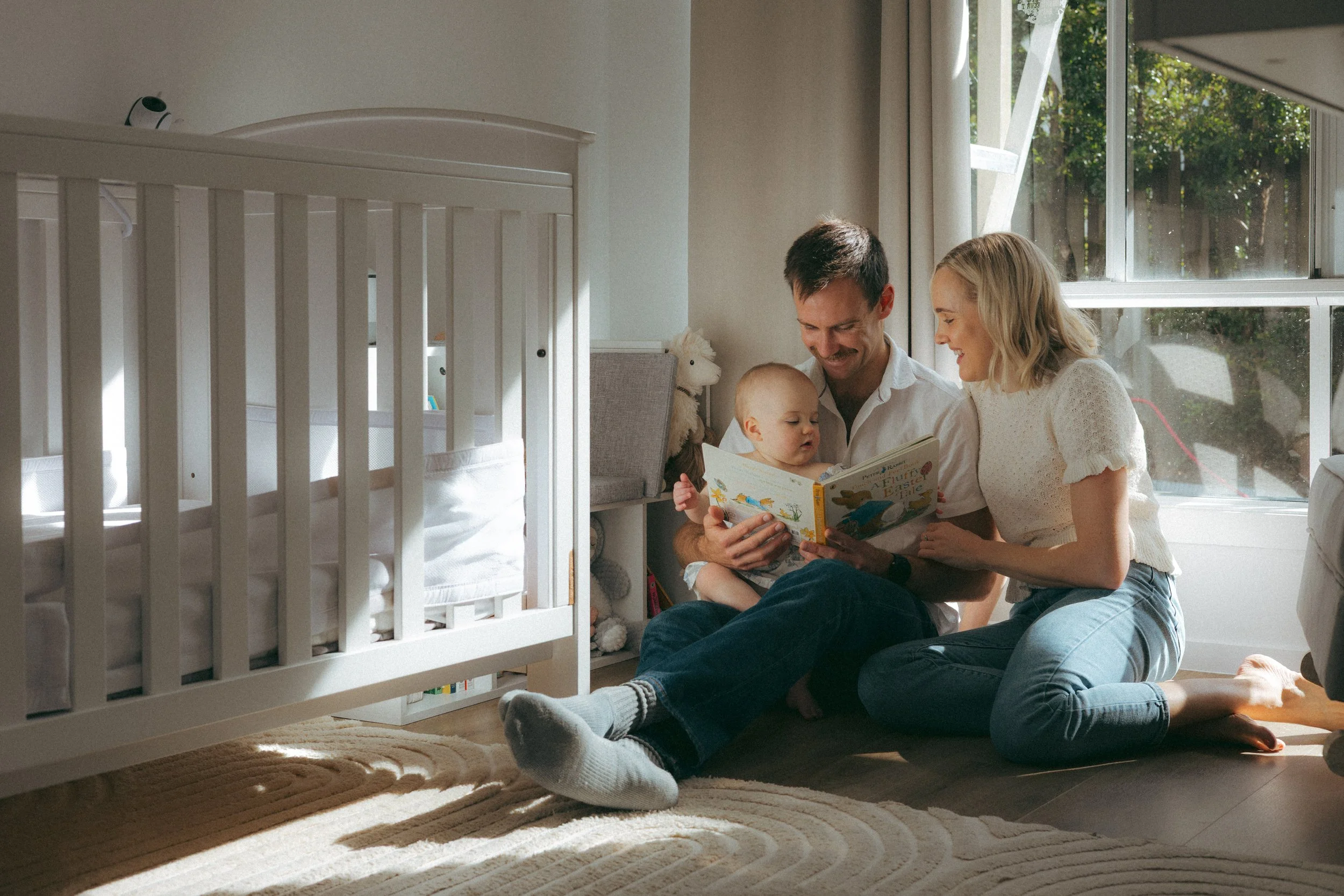 family relaxing at home with 1 year old during lifestyle photography session