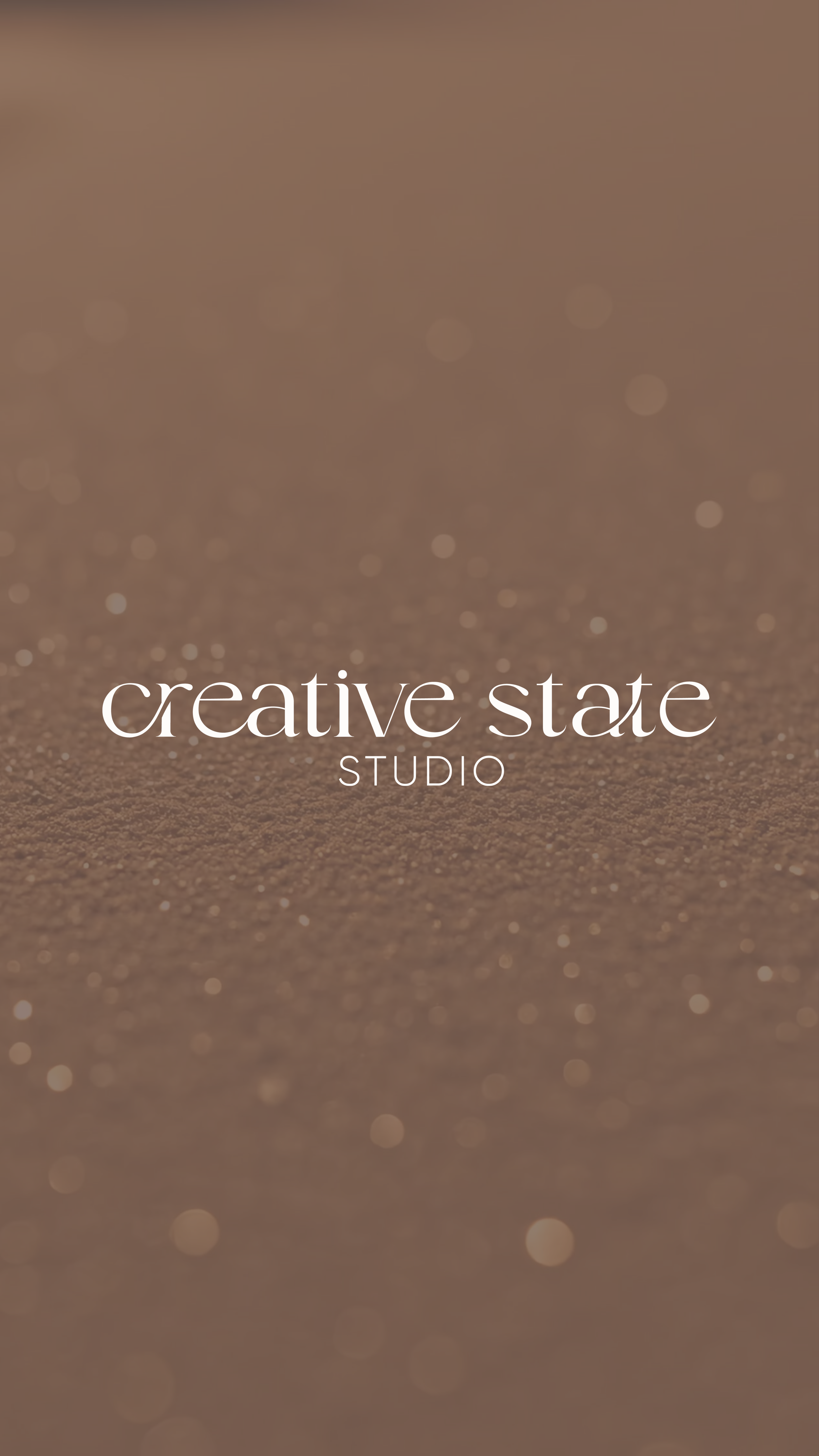 Text on a sandy background that reads 'creative state studio' in white, elegant font.