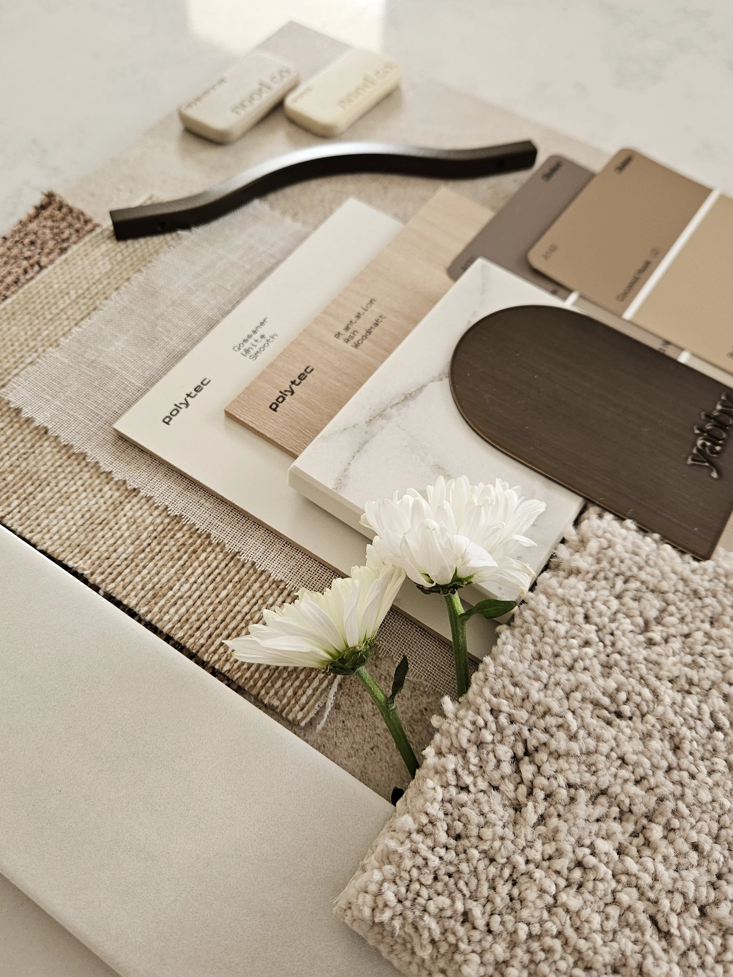 Interior material palette with fabric samples, finishes and neutral textures