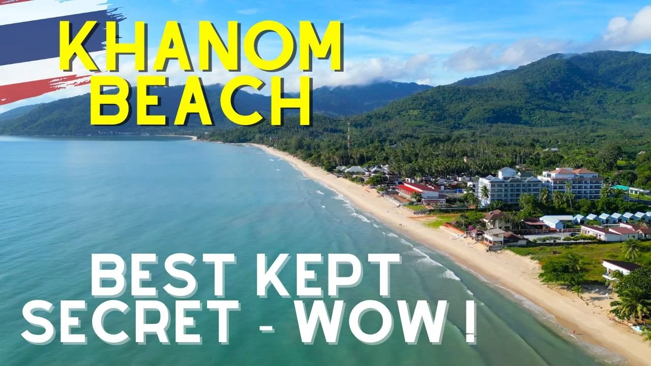 Aerial view of Khnom Beach with clear blue water, sandy shoreline, and lush green mountains in the background, with text overlay reading "Khnom Beach" and "Best Kept Secret - Wow!"