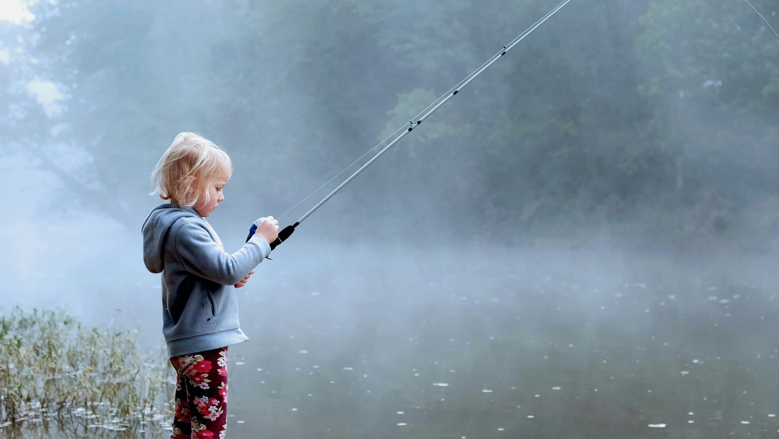 female child fishing