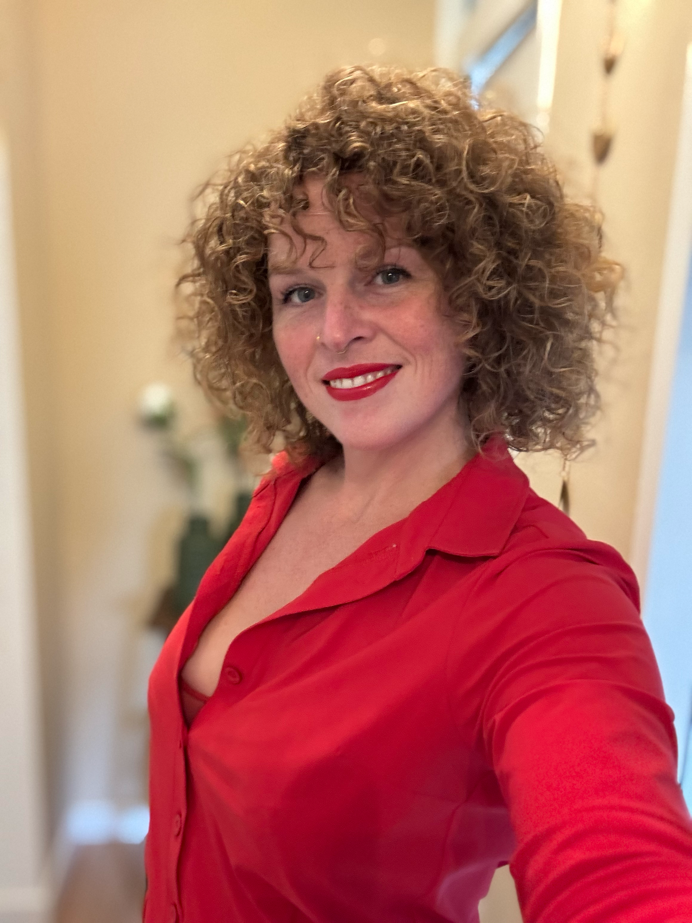 Travel companion, escort, erotic masseuse, muse, guide in sensuality. Hot girl in red.