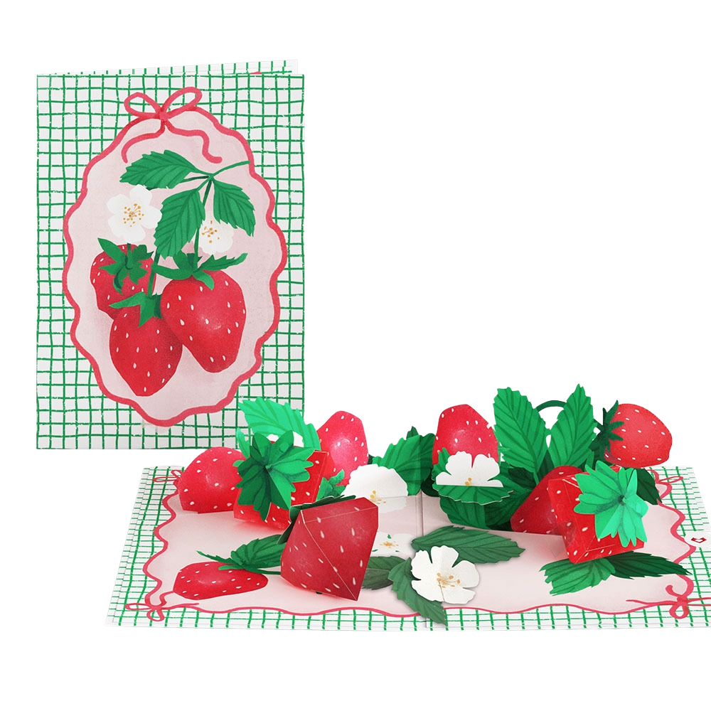 A pop-up greeting card with a strawberry theme, featuring strawberries, green leaves, and white flowers, with a grid pattern background.