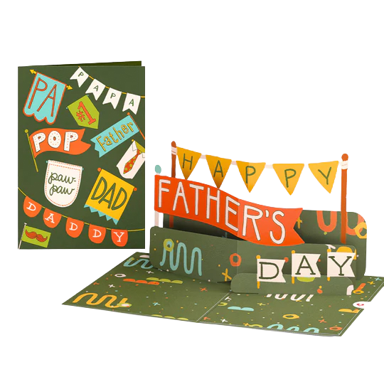 Open Father's Day pop-up card with colorful banners reading 'HAPPY FATHER'S DAY,' featuring decorative elements and words like 'Papa,' 'pop,' 'dad,' and 'daddy.'