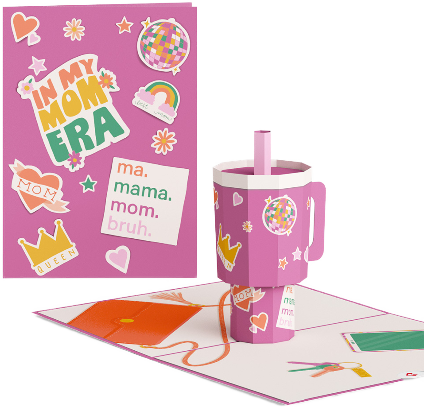 A pink greeting card with stickers and messages about moms, including a rainbow, disco ball, hearts, stars, and a crown that says 'Queen'. A pink and purple paper mug with a handle decorated with similar stickers, placed on a card with a string, pair of scissors, and paper items.